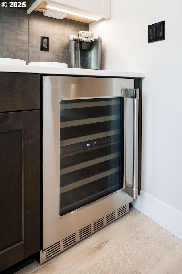 kitchen view of wine cooler and baseboards