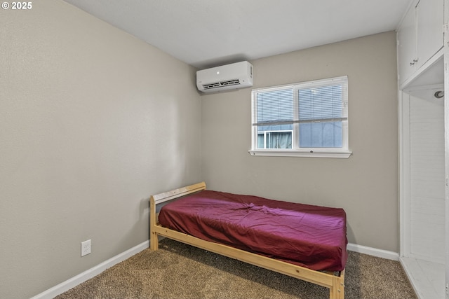 carpeted bedroom with a wall unit AC