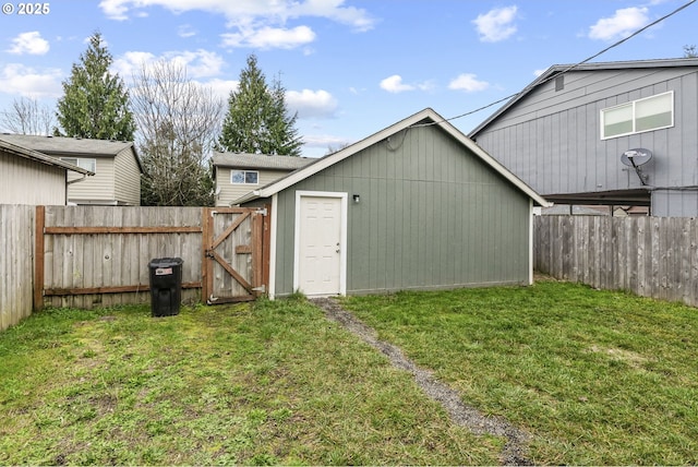 view of outbuilding with a yard