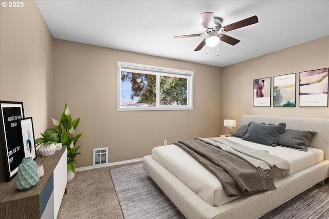 bedroom with carpet, baseboards, and a ceiling fan