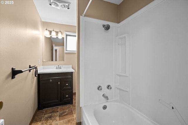 bathroom featuring vanity and shower / tub combination