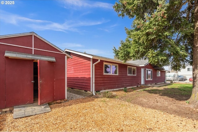 view of home's exterior featuring an outdoor structure