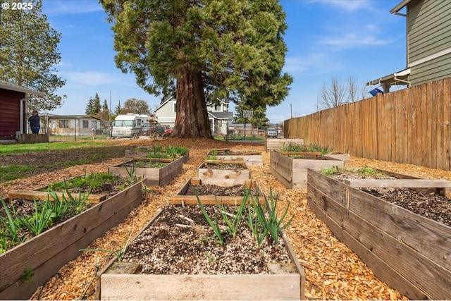 view of yard featuring a garden and fence