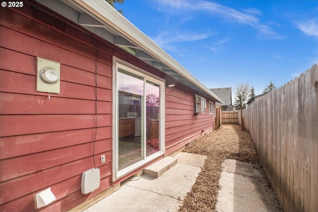 view of side of property with a fenced backyard