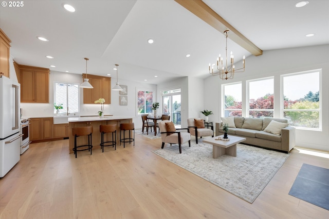 13212 SE Terra Cascade Dr, Happy Valley, OR 97086 - living room with light wood-style floors, recessed lighting, and a chandelier