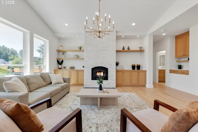 13212 SE Terra Cascade Dr, Happy Valley, OR 97086 - living room featuring light wood-style floors, a chandelier, a fireplace, recessed lighting, and baseboards