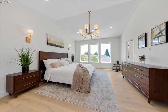 13212 SE Terra Cascade Dr, Happy Valley, OR 97086 - bedroom featuring vaulted ceiling, a chandelier, light wood finished floors, and recessed lighting