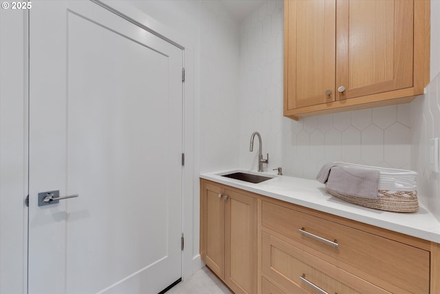 13212 SE Terra Cascade Dr, Happy Valley, OR 97086 - bar area with a sink, backsplash, and light tile patterned floors