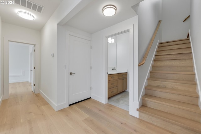 13212 SE Terra Cascade Dr, Happy Valley, OR 97086 - foyer with light wood-type flooring, stairs, and baseboards