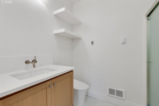 13212 SE Terra Cascade Dr, Happy Valley, OR 97086 - bathroom with toilet, tile patterned floors, vanity, and baseboards