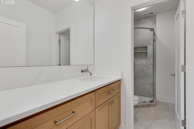 13212 SE Terra Cascade Dr, Happy Valley, OR 97086 - bathroom with vanity, toilet, a shower stall, and tile patterned floors