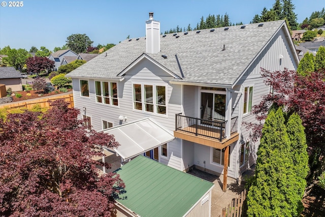 13212 SE Terra Cascade Dr, Happy Valley, OR 97086 - back of property featuring a balcony, a chimney, and roof with shingles