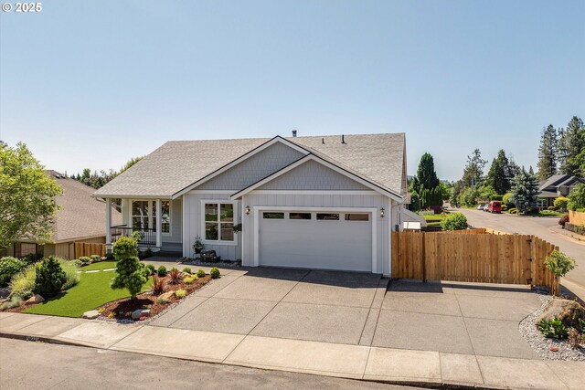 13212 SE Terra Cascade Dr, Happy Valley, OR 97086 - view of front of property featuring concrete driveway, roof with shingles, an attached garage, and board and batten siding