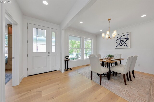 13212 SE Terra Cascade Dr, Happy Valley, OR 97086 - dining space featuring a chandelier, light wood-style floors, recessed lighting, and ornamental molding