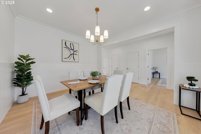 13212 SE Terra Cascade Dr, Happy Valley, OR 97086 - dining room featuring a chandelier, crown molding, light wood finished floors, and recessed lighting