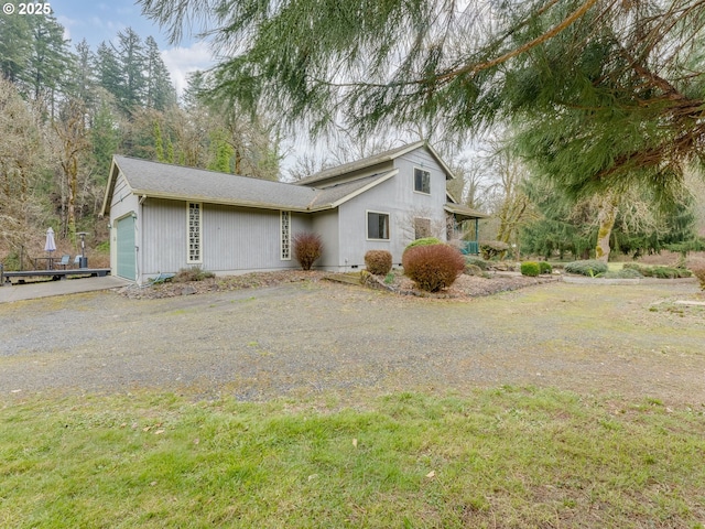 exterior space featuring an attached garage and driveway