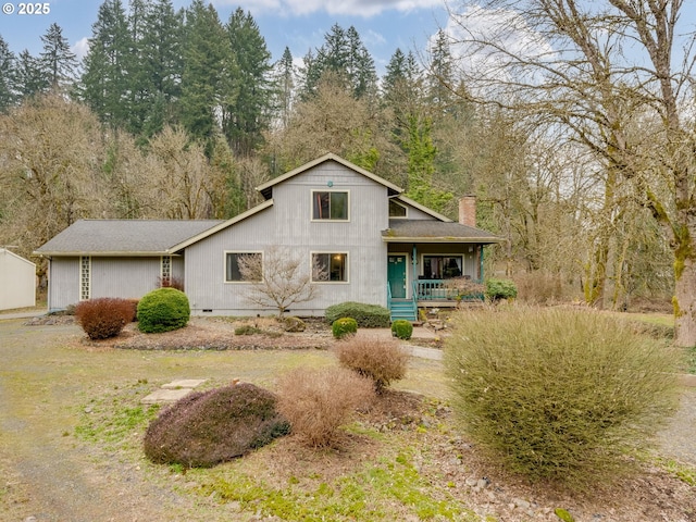 view of front of property featuring a porch and a chimney