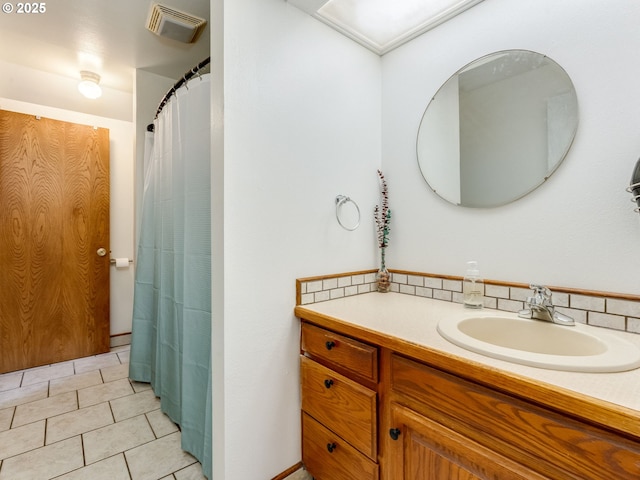 bathroom featuring vanity, tile patterned floors, and visible vents