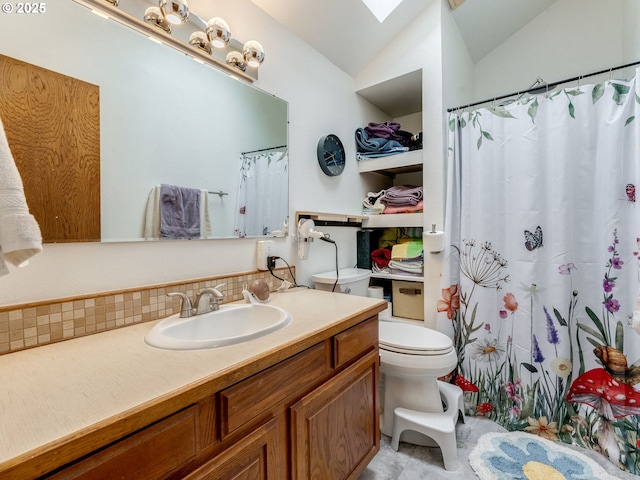 full bathroom with vanity, a shower with shower curtain, decorative backsplash, lofted ceiling with skylight, and toilet