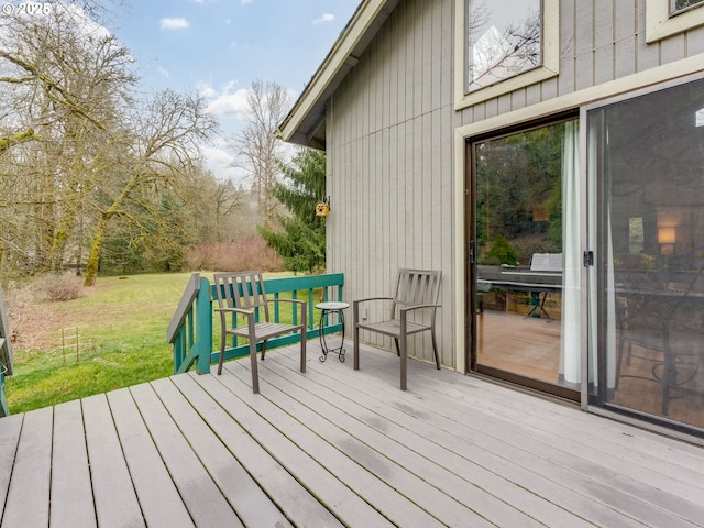 wooden deck with a yard