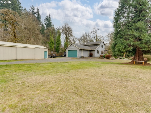 view of yard with a garage