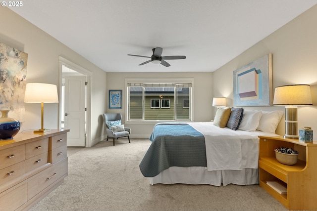 16185 NW Ashfield Dr, Beaverton, OR 97006 - bedroom featuring light colored carpet, baseboards, and a ceiling fan