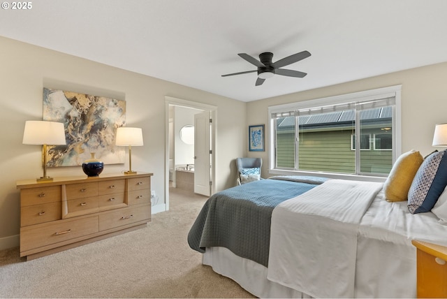 16185 NW Ashfield Dr, Beaverton, OR 97006 - bedroom featuring light colored carpet, baseboards, ceiling fan, and ensuite bath