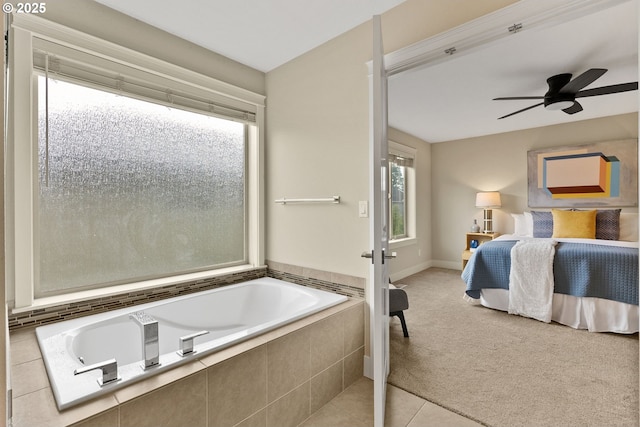 16185 NW Ashfield Dr, Beaverton, OR 97006 - full bathroom with ensuite bathroom, a garden tub, a ceiling fan, tile patterned floors, and baseboards