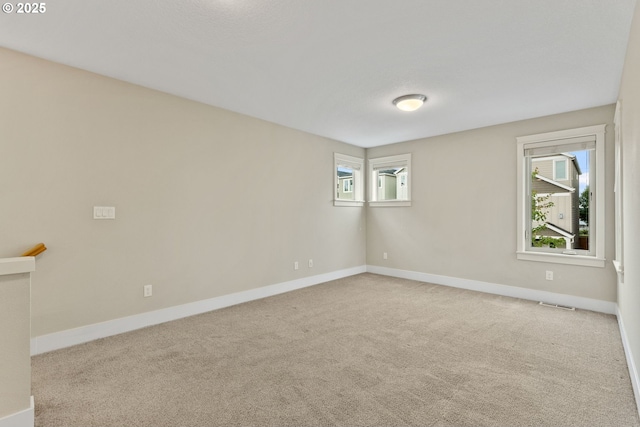 16185 NW Ashfield Dr, Beaverton, OR 97006 - carpeted spare room featuring baseboards