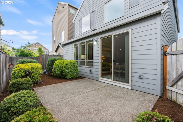 16185 NW Ashfield Dr, Beaverton, OR 97006 - fenced backyard with a patio