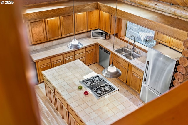 89935 Greenwood Dr, Leaburg, OR 97489 - kitchen featuring decorative backsplash, stainless steel appliances, a sink, and tile countertops