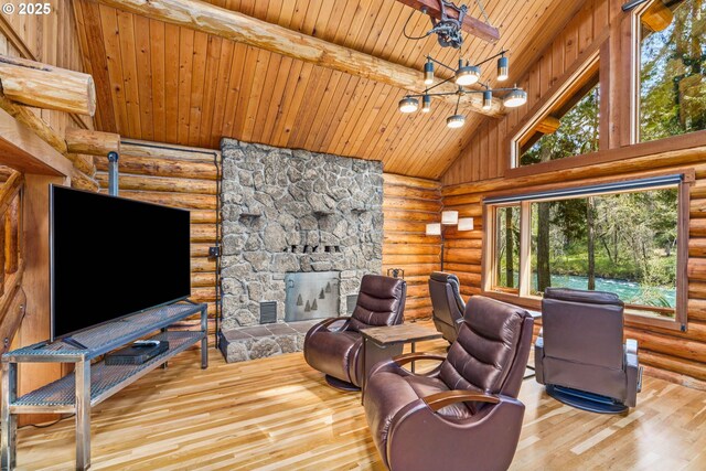 89935 Greenwood Dr, Leaburg, OR 97489 - living room with a notable chandelier, log walls, wood finished floors, wooden ceiling, and high vaulted ceiling