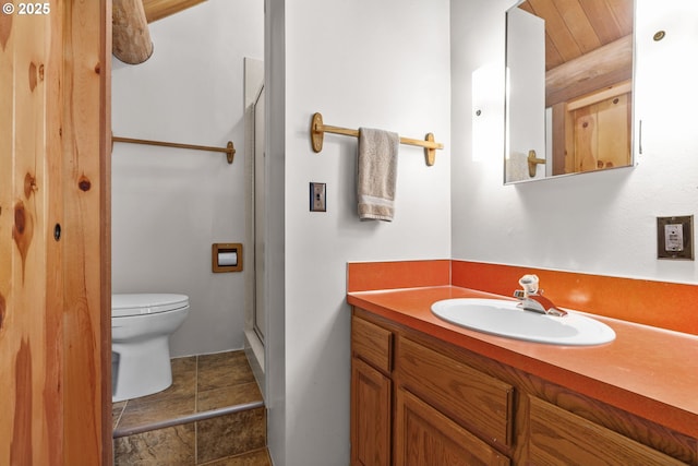 89935 Greenwood Dr, Leaburg, OR 97489 - bathroom featuring toilet, vanity, and a stall shower