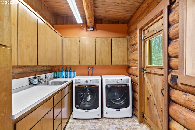 89935 Greenwood Dr, Leaburg, OR 97489 - clothes washing area featuring washing machine and clothes dryer, a sink, rustic walls, cabinet space, and wood ceiling