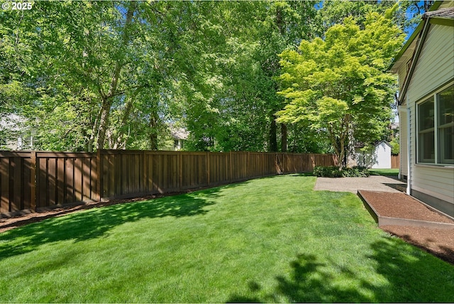 view of yard featuring an outbuilding and a shed