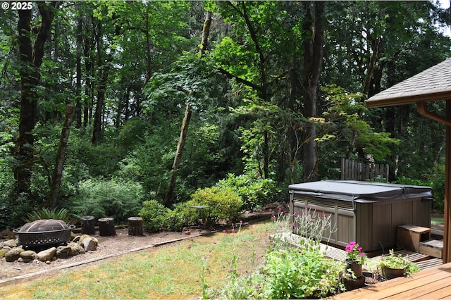 89016 Bridge St, Springfield, OR 97478 - view of yard with a hot tub, a fire pit, a wooden deck, and a wooded view