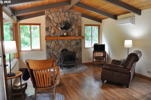 89016 Bridge St, Springfield, OR 97478 - living room featuring an AC wall unit, a wood stove, plenty of natural light, wood finished floors, and wood ceiling