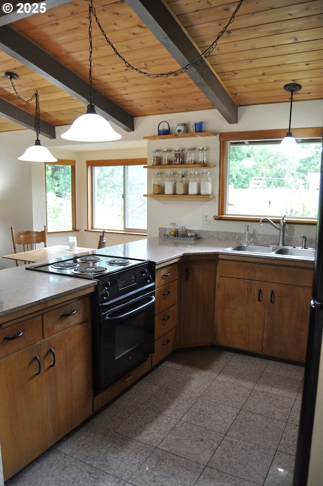 89016 Bridge St, Springfield, OR 97478 - kitchen with black range with electric stovetop, a wooden ceiling with exposed beams, granite tiled floors, plenty of natural light, and pendant lighting