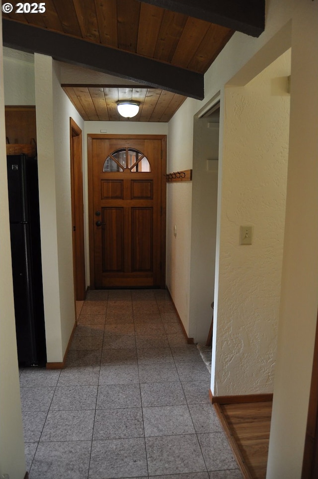 89016 Bridge St, Springfield, OR 97478 - hallway with a wooden ceiling with exposed beams, light tile patterned floors, and a textured wall
