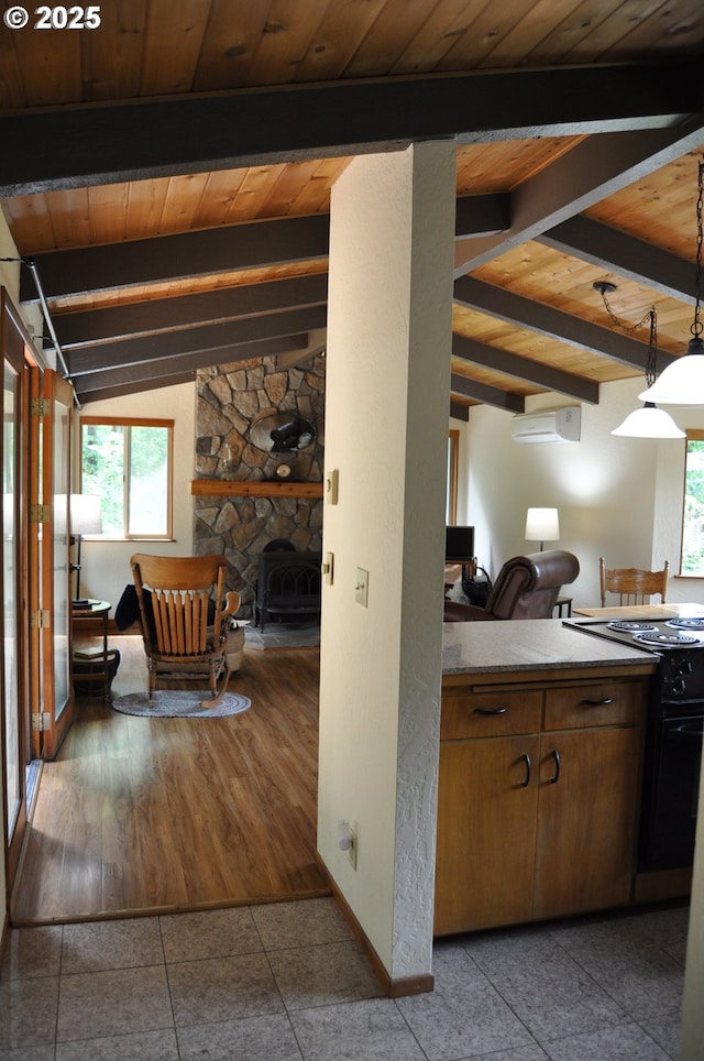 89016 Bridge St, Springfield, OR 97478 - kitchen with black electric range oven, wooden ceiling, a wall mounted AC, healthy amount of natural light, and tile patterned flooring
