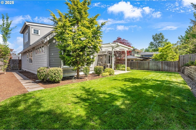 view of yard featuring a patio, a fenced backyard, and a pergola
