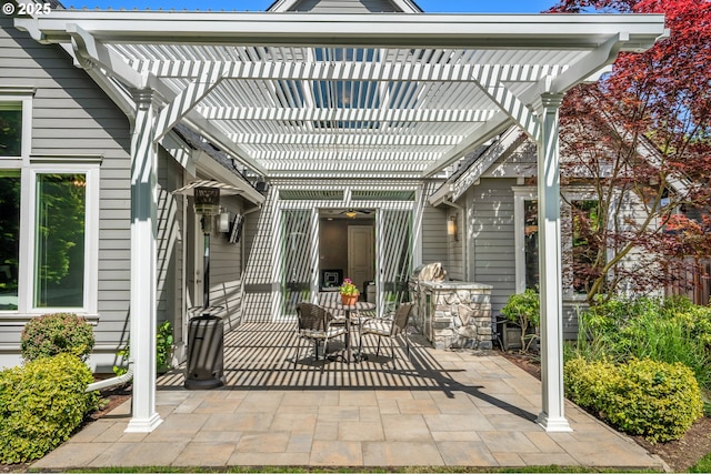 view of patio featuring outdoor dining area and a pergola