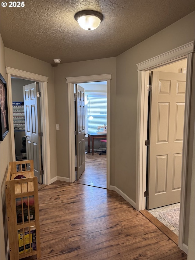 1809 Balm St, Baker City, OR 97814 - corridor featuring wood finished floors and a textured ceiling