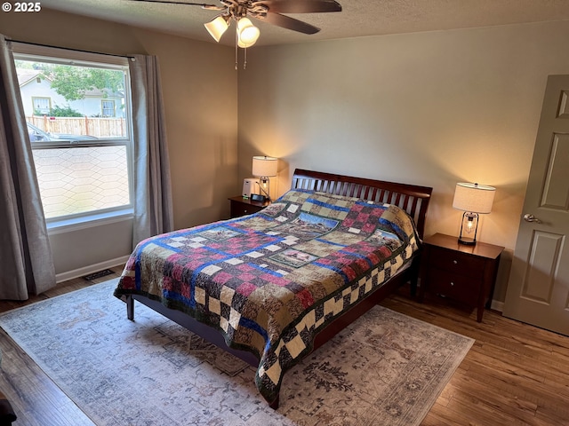 1809 Balm St, Baker City, OR 97814 - bedroom with wood finished floors, ceiling fan, and a textured ceiling