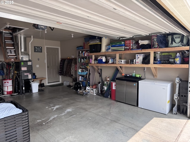 1809 Balm St, Baker City, OR 97814 - garage featuring white refrigerator and a garage door opener