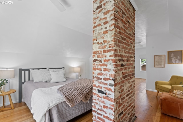 6736 N Haight Ave, Portland, OR 97217 - bedroom featuring wood-type flooring, vaulted ceiling, a ceiling fan, and baseboards