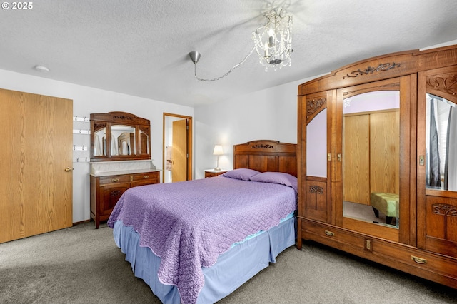 bedroom featuring light carpet, a textured ceiling, and an inviting chandelier