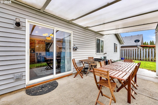 exterior space featuring fence and outdoor dining space