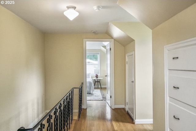 8100 SW 6th Ave, Portland, OR 97219 - corridor featuring an upstairs landing, wood finished floors, baseboards, and lofted ceiling