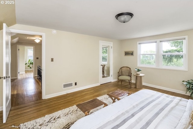 8100 SW 6th Ave, Portland, OR 97219 - bedroom with multiple windows, wood finished floors, and baseboards